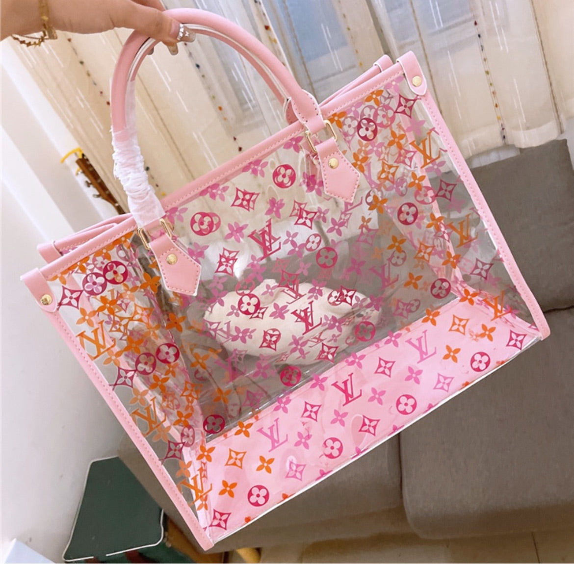 Pink transparent LV a woman handbag